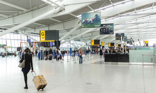 A female passenger arrives for checkin at the departure hall in Terminal 5, Heathrow Airport.